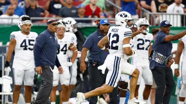 Brigham Young Cougars wide receiver Puka Nacua (12) runs the ball in for a touchdown against the South Florida Bulls during the first half at Raymond James Stadium.